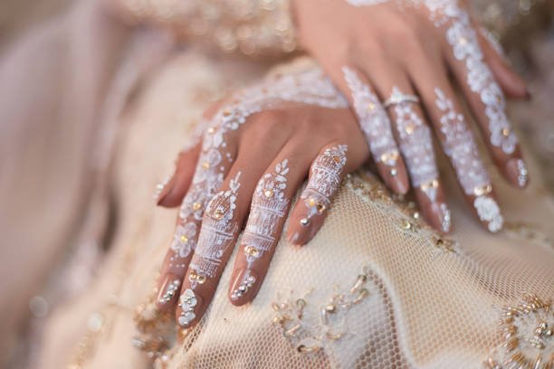 Indonesian Wedding Henna Art On Bride's hand beautifully decorated, selective focus