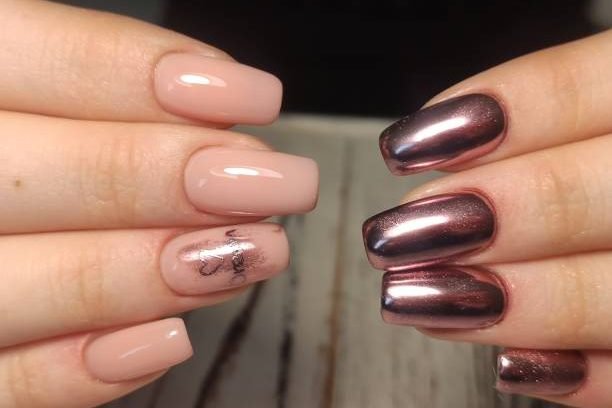 Trendy manicure design on a beautiful textural background.